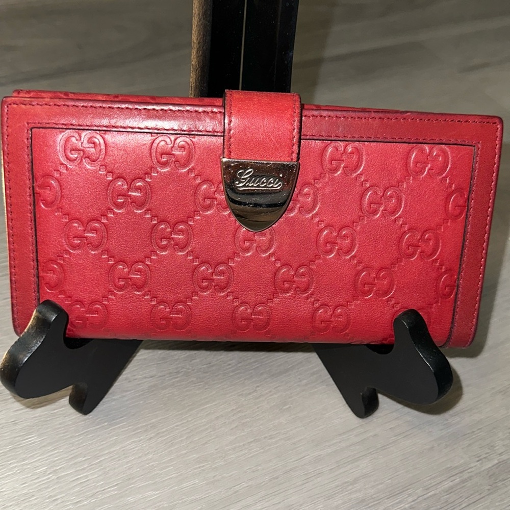 Red leather, Gucci flap, wallet, beautiful. Lots of life still left in her.